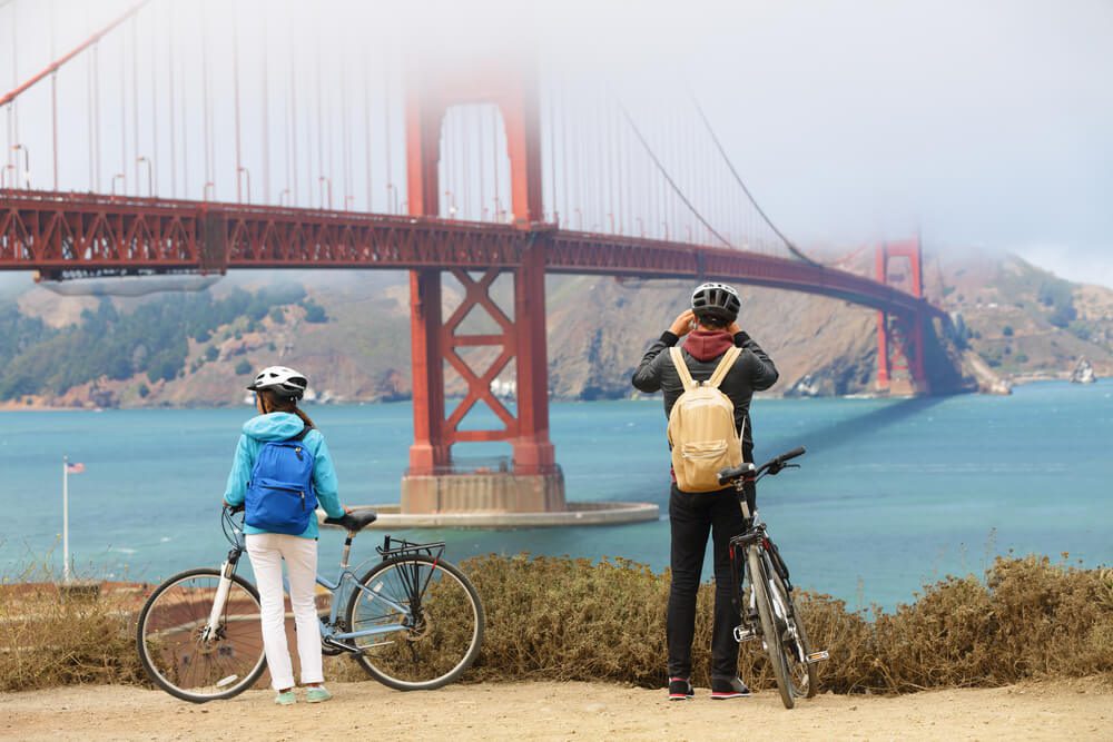 Photo of two people looking at the golden fate bridge on a San Francisco tour.